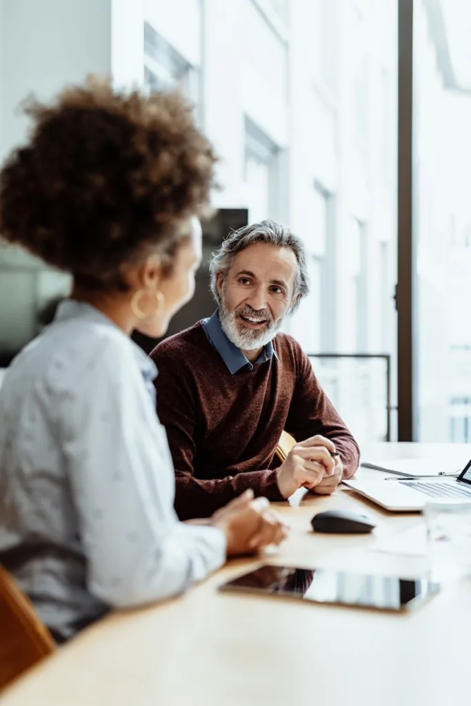 Business people dressed in smart casual clothing working in office